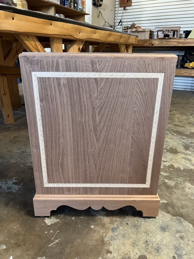 Lunette inlay banding set flush into the mahogany door panel of a grandfather clock replica
