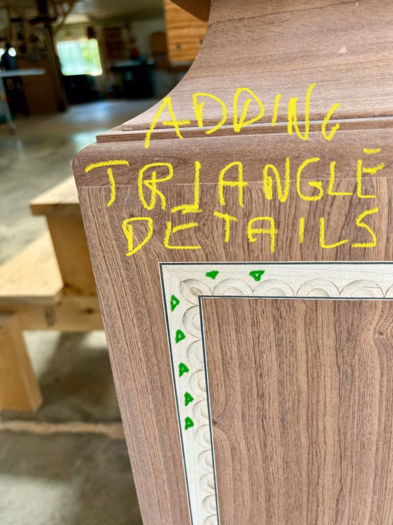 Shop photo marked in green ink showing where triangle details would be burned into the maple inlay