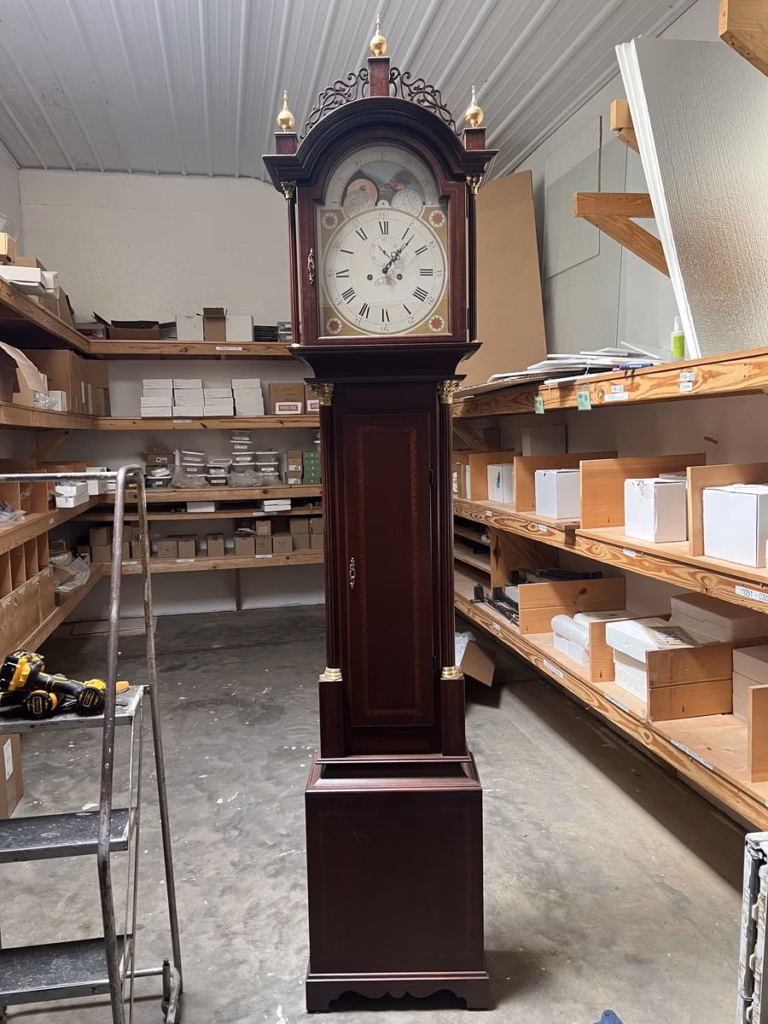 Completed mahogany replica of the Seymour tall case clock with hand-painted dial and brass finials